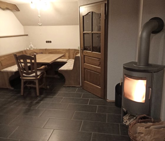Living/dining room with soapstone stove Living/dining room with soapstone stove